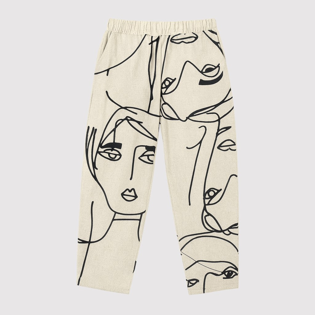 Cropped tapered pants with abstract face line-art print.