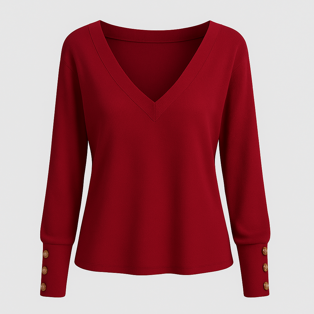 V-neck blouse with long sleeves and decorative button-cuff detail.
