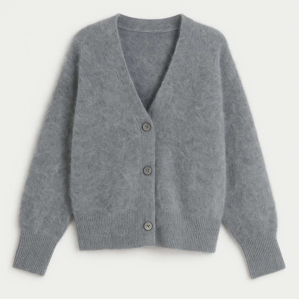 Soft fuzzy cardigan with button front, V-neckline, and relaxed silhouette designed for cozy layering