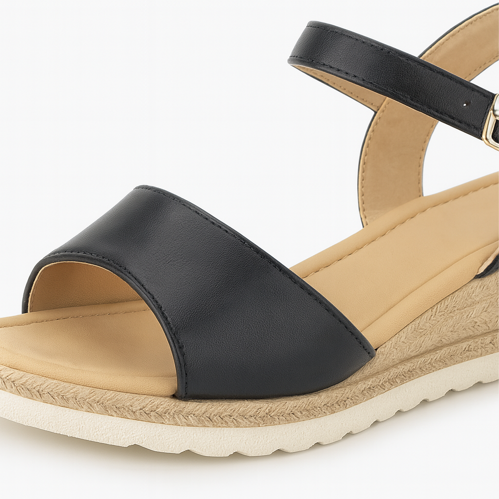 Wedge sandal with ankle strap, buckle closure, and textured midsol