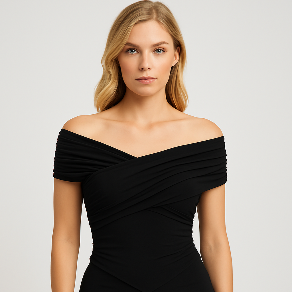 Black off shoulder wrap top with short sleeves and pointed hem, styled with denim shorts for a modern casual look