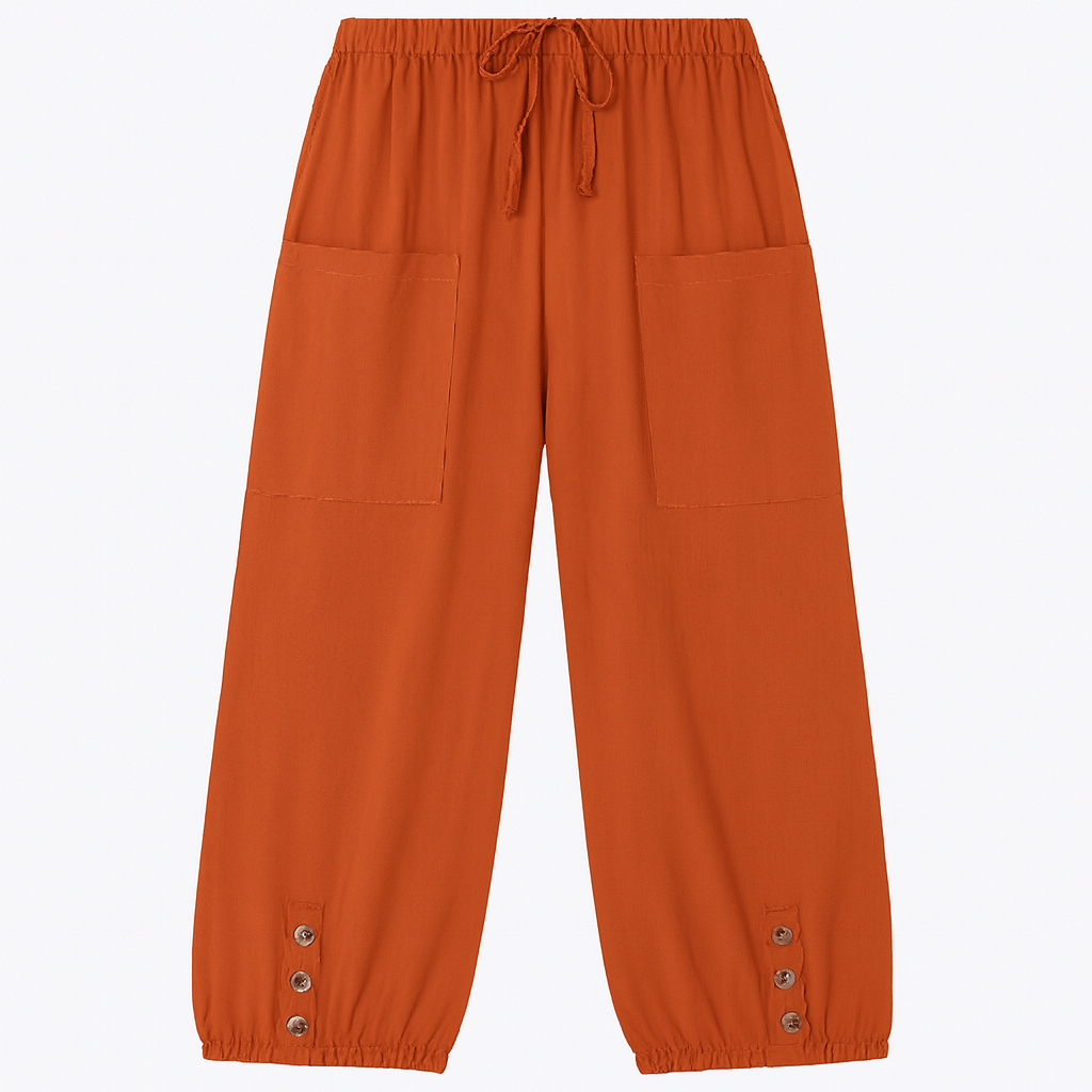 Relaxed jogger pants with elastic waistband, patch pockets, and buttoned hem details, styled for casual everyday wear
