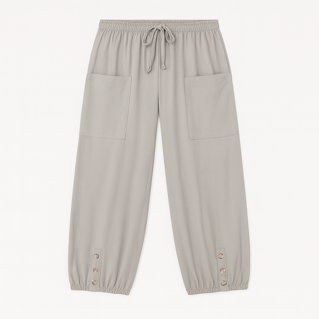 y
Relaxed jogger pants with elastic waistband, patch pockets, and buttoned hem details, styled for casual everyday wear