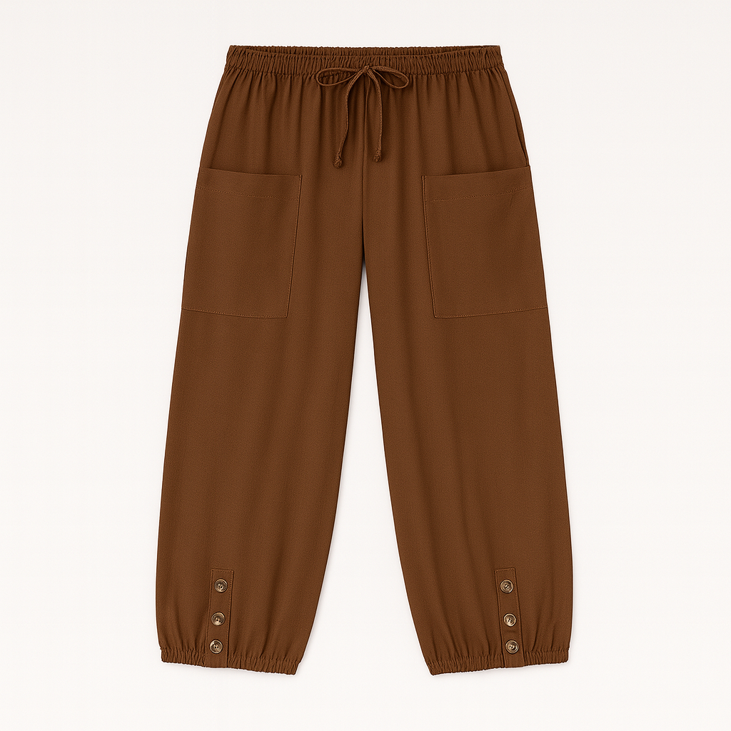 Relaxed jogger pants with elastic waistband, patch pockets, and buttoned hem details, styled for casual everyday wear