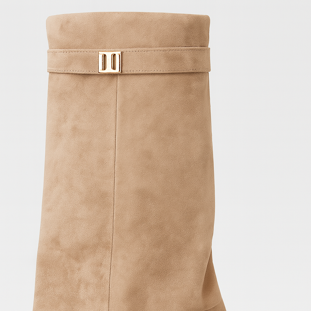 Over-the-knee suede boots with pointed toes, side zips, wide folded cuffs, and decorative metal accents.