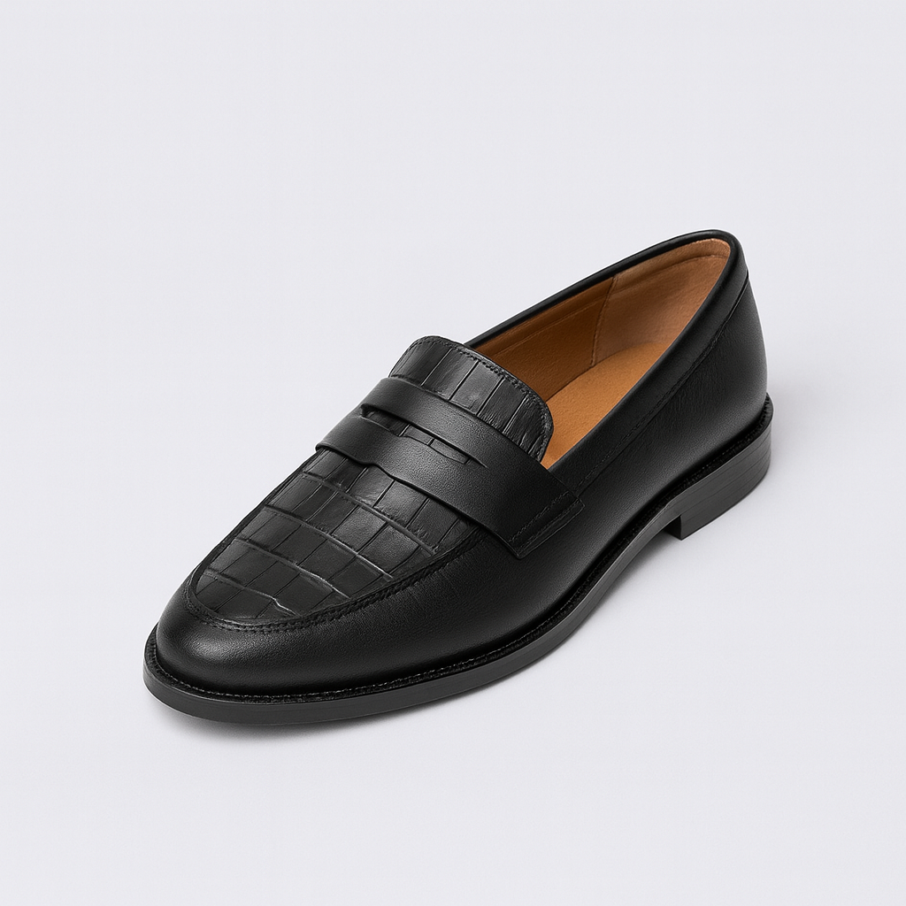 Penny loafer with textured upper, rounded toe, and low stacked heel.