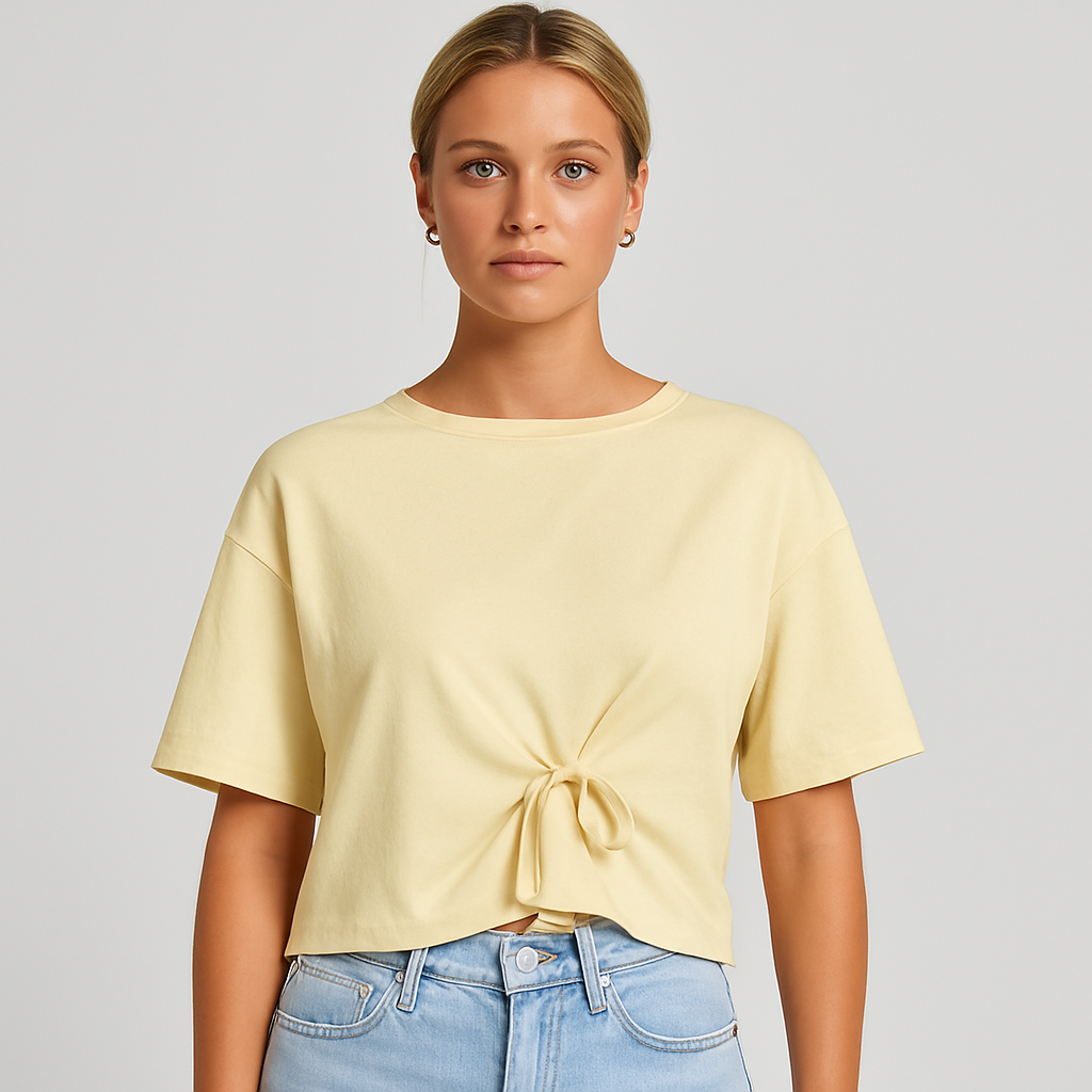 cream cropped top with short sleeves and a tie-front detail at the waist