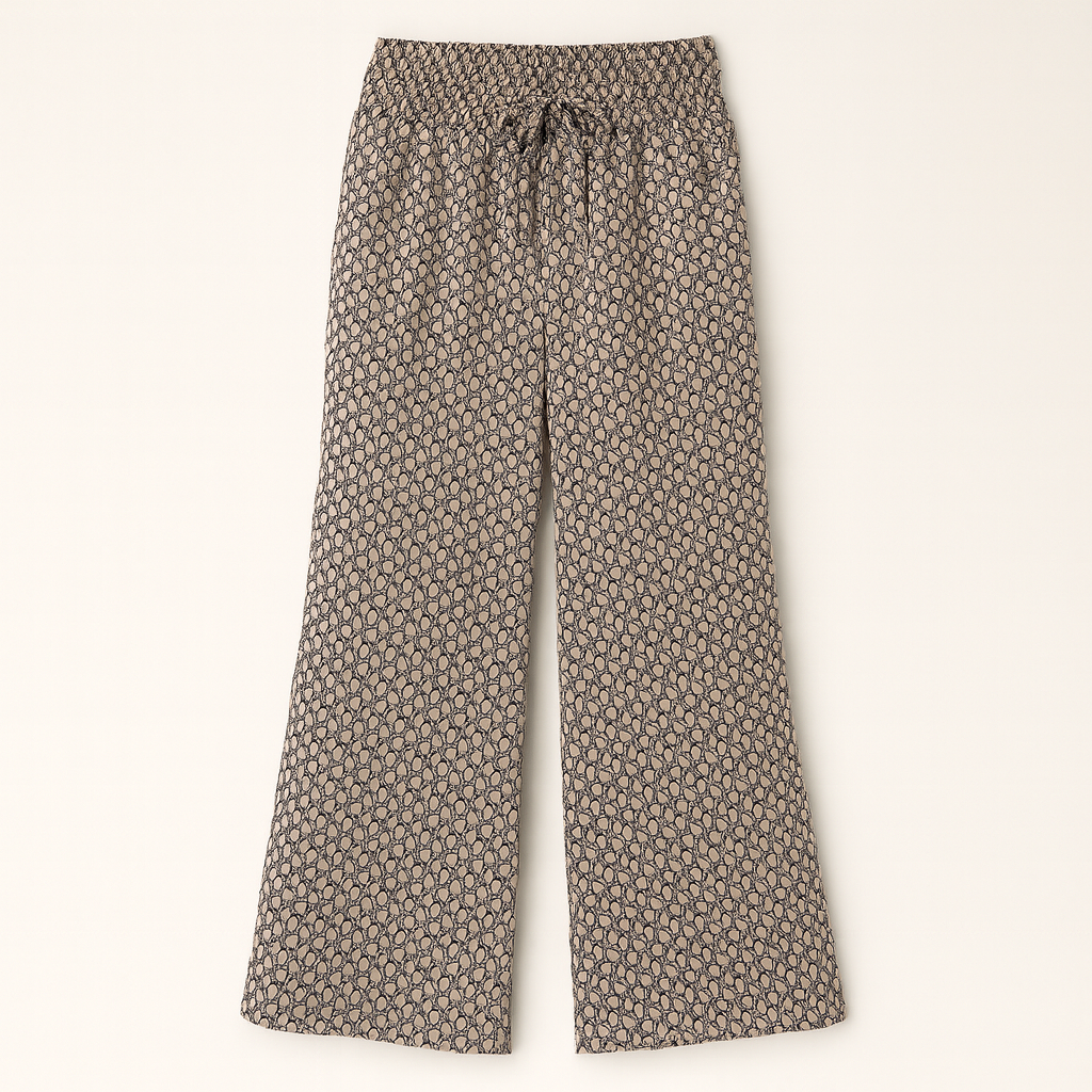 Wide-leg patterned pants with elastic waistband and drawstring tie.