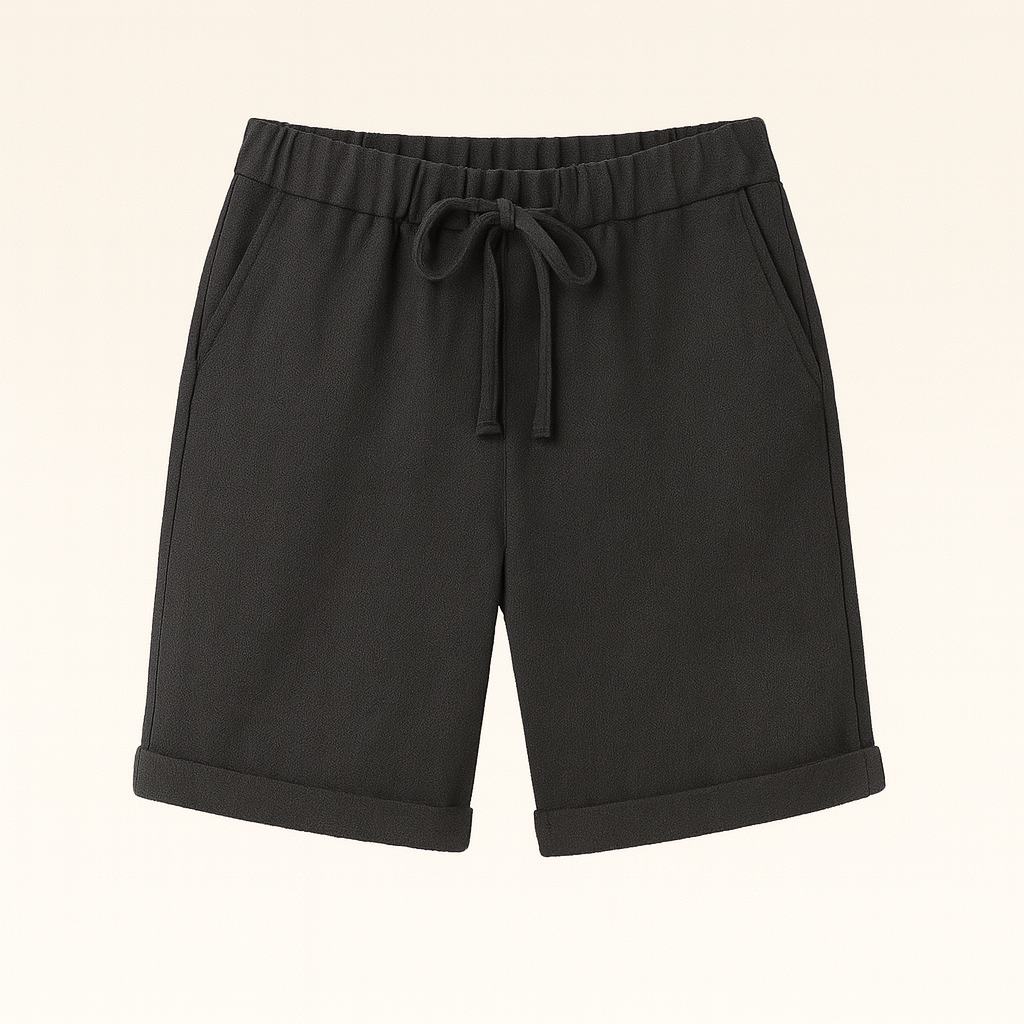 Relaxed linen Bermuda shorts with drawstring waist and cuffed hem, styled for an effortless casual look.