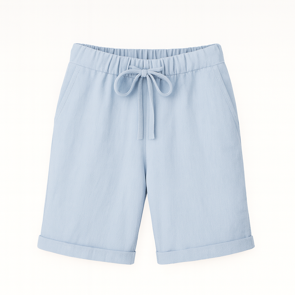 Relaxed linen Bermuda shorts with drawstring waist and cuffed hem, styled for an effortless casual look.