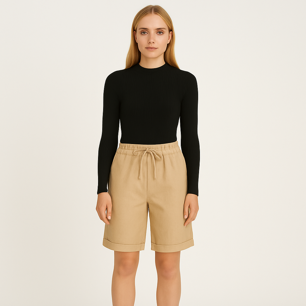 Relaxed linen Bermuda shorts with drawstring waist and cuffed hem, styled for an effortless casual look.