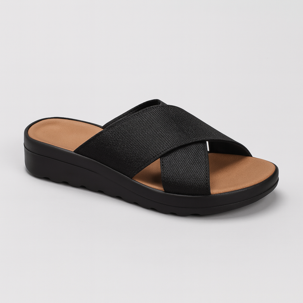 Slide sandal with wide crisscross straps and contoured sole.