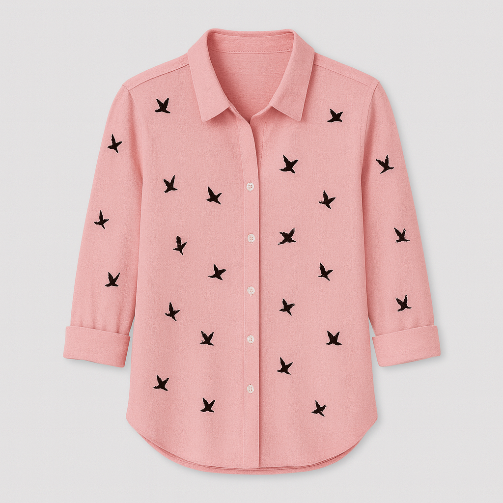 Button-up blouse with black bird print pattern, collared neckline, and 3/4 rolled sleeves.