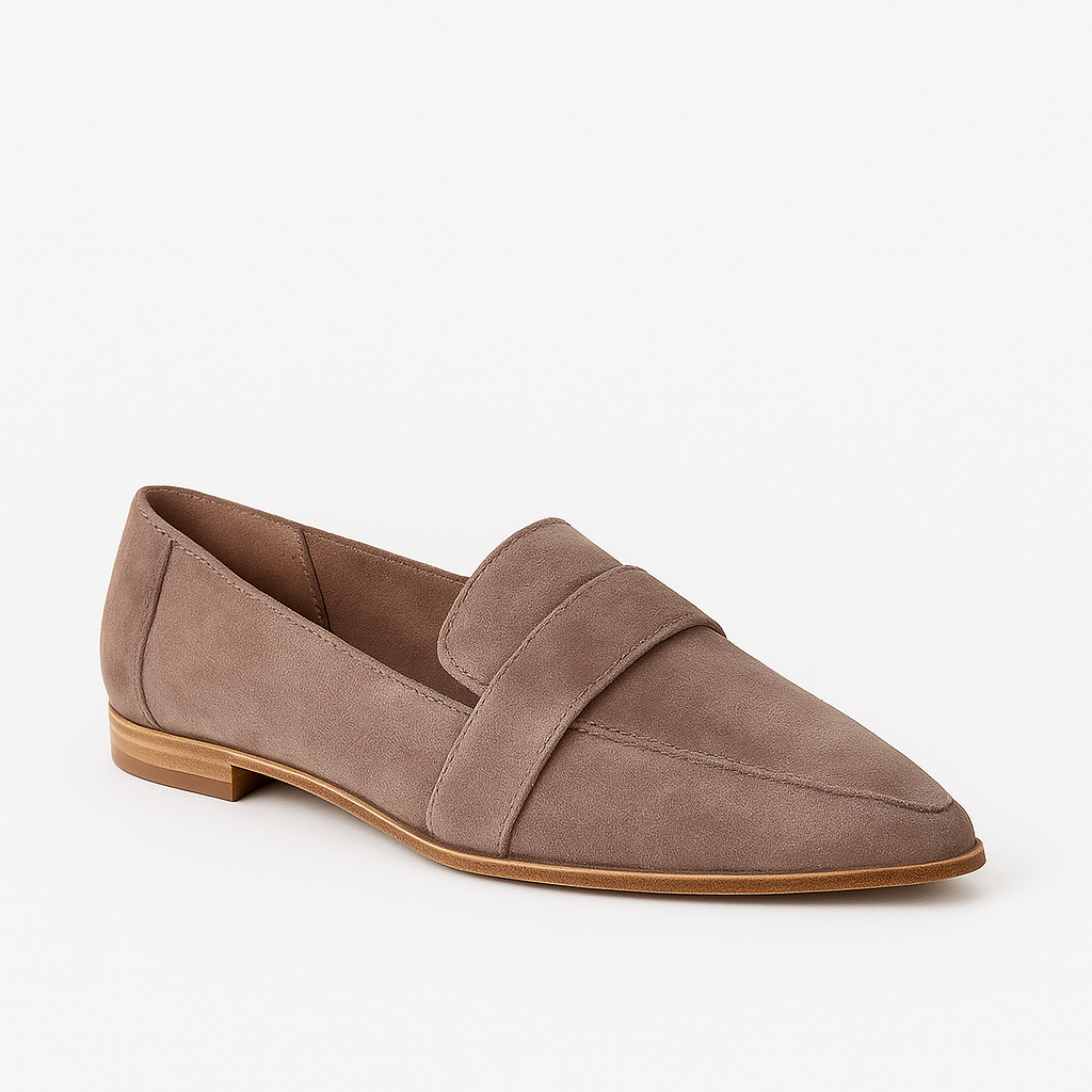 Suede loafer with a pointed toe, low heel, and strap detail across the upper.