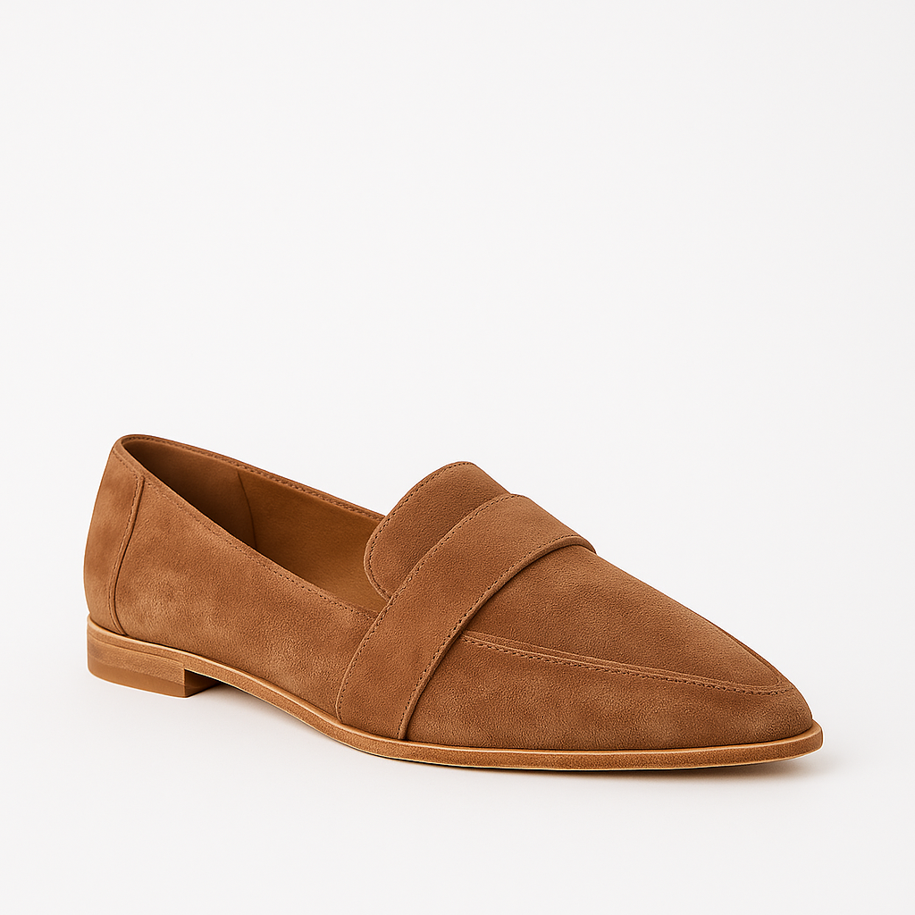 Suede loafer with a pointed toe, low heel, and strap detail across the upper.