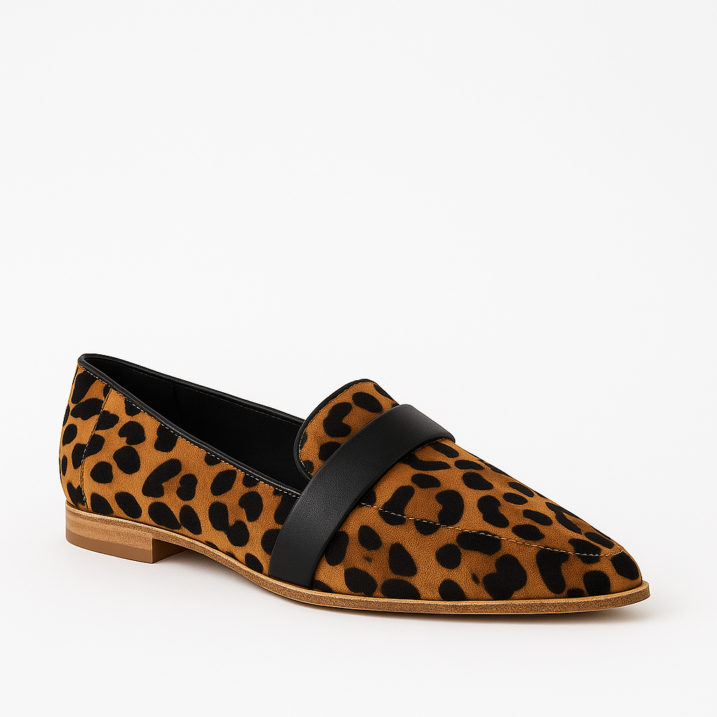 Suede loafer with a pointed toe, low heel, and strap detail across the upper.