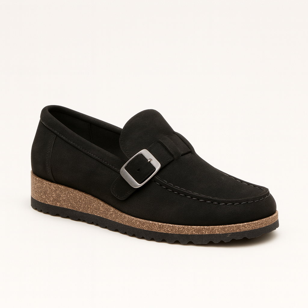 Black loafer with buckle detail, cork-textured platform sole, and slip-on design