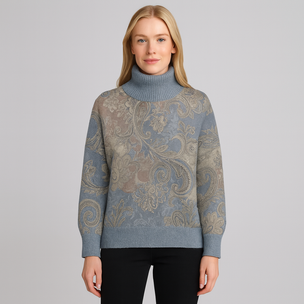A patterned turtleneck sweater featuring intricate paisley and floral designs, with ribbed cuffs, hem, and a tall ribbed turtleneck.