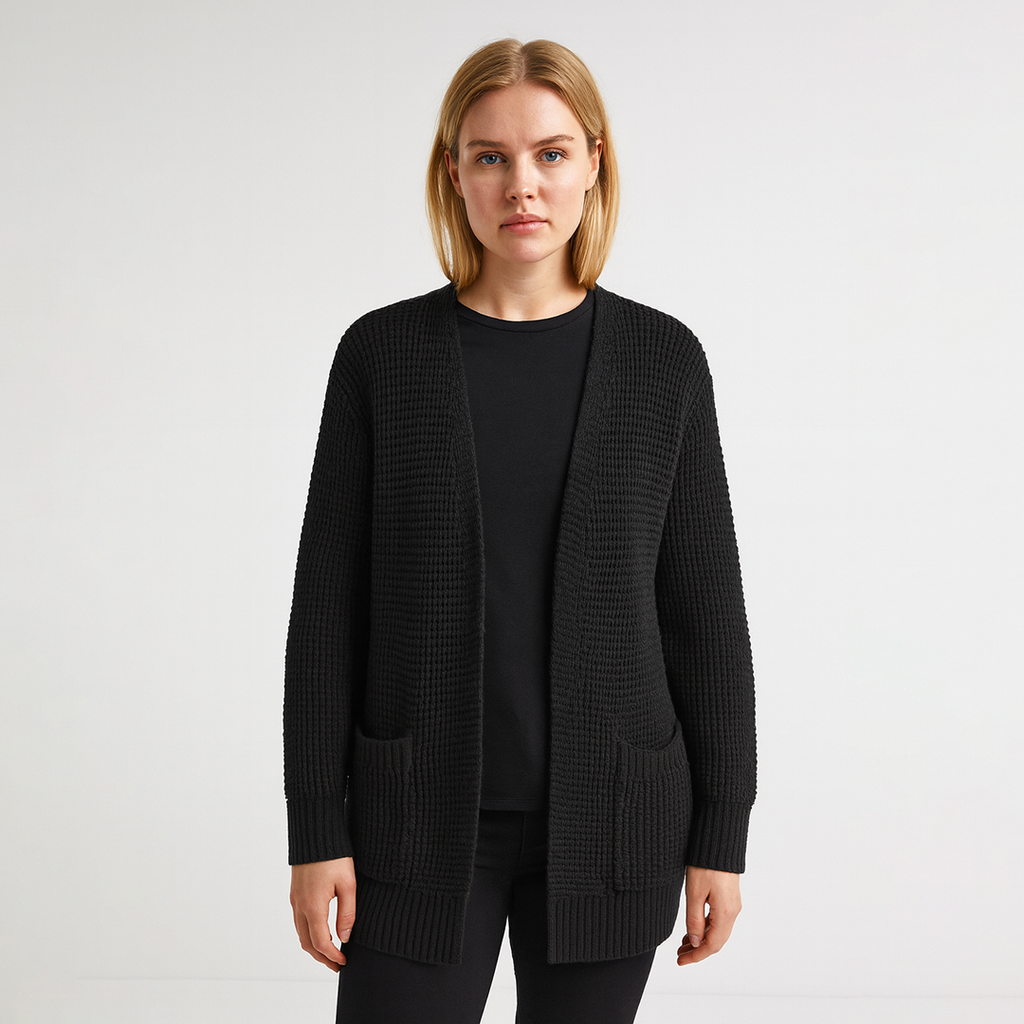 A long open-front knit cardigan with a textured waffle pattern, ribbed cuffs and hem, and two front patch pockets.