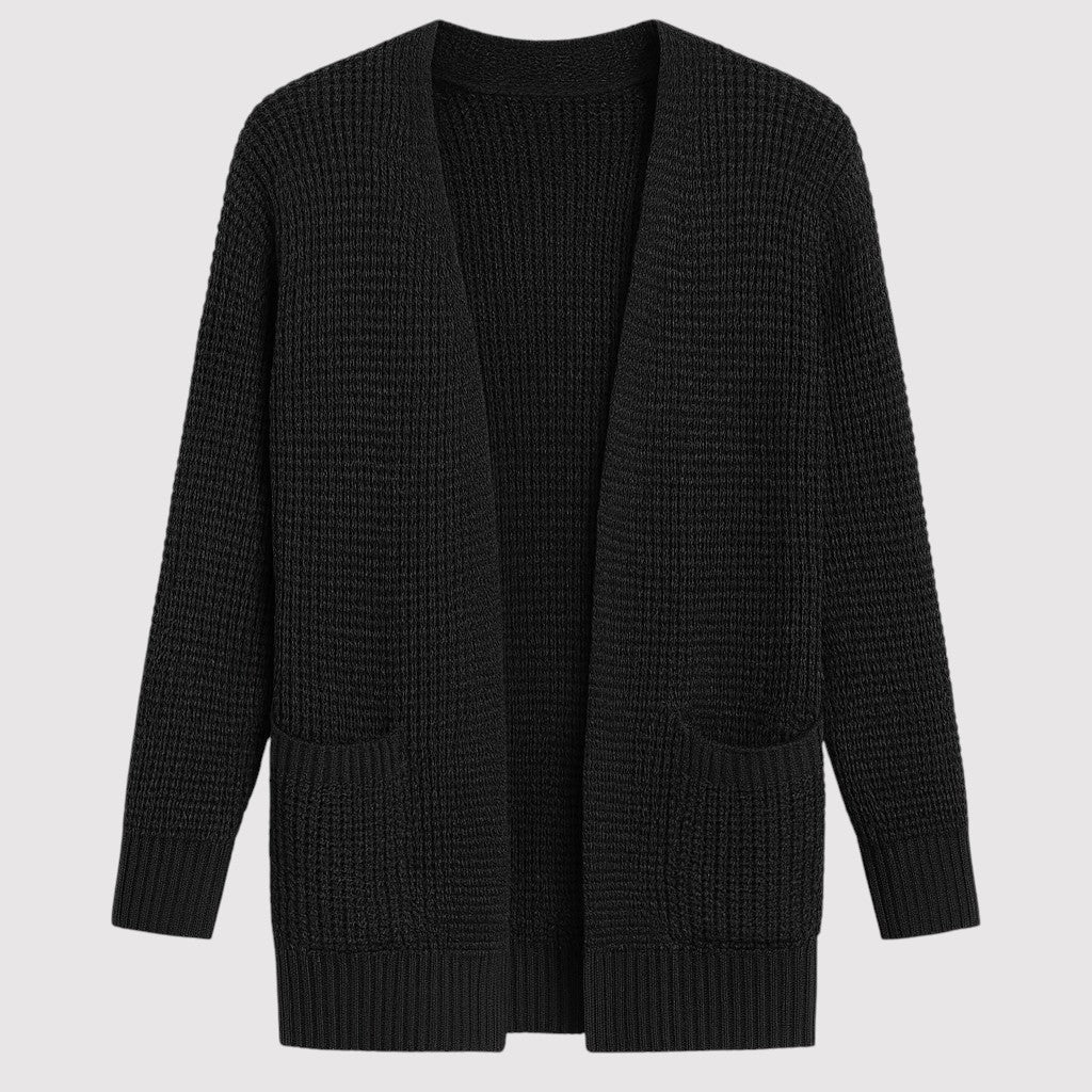 A long open-front knit cardigan with a textured waffle pattern, ribbed cuffs and hem, and two front patch pockets.