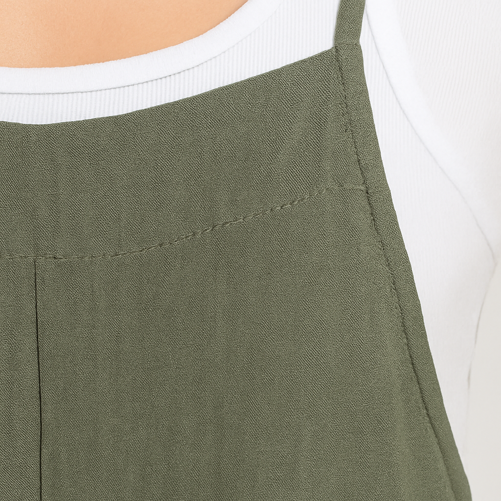 Sleeveless jumpsuit with wide straps, straight neckline, and wide-leg pants.