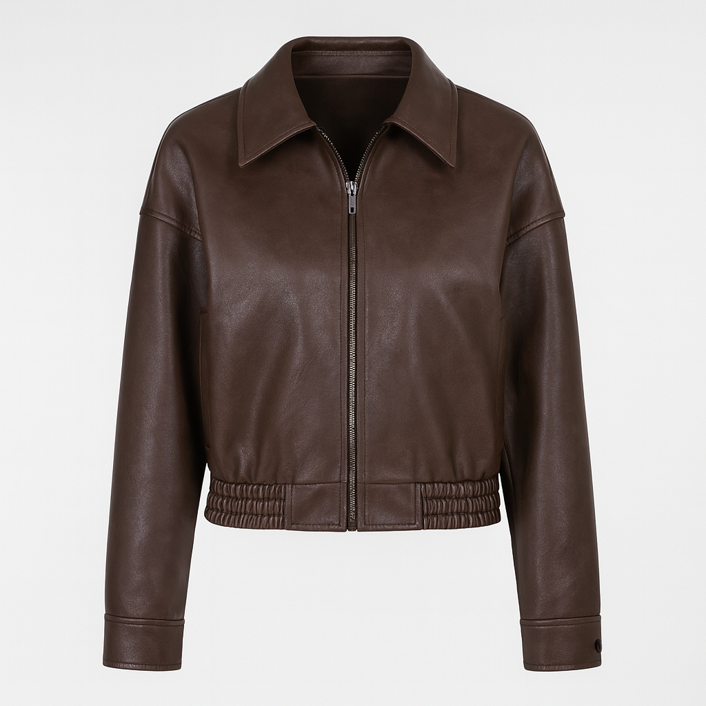 A cropped faux leather jacket with a pointed collar, zip front, and elasticated hem