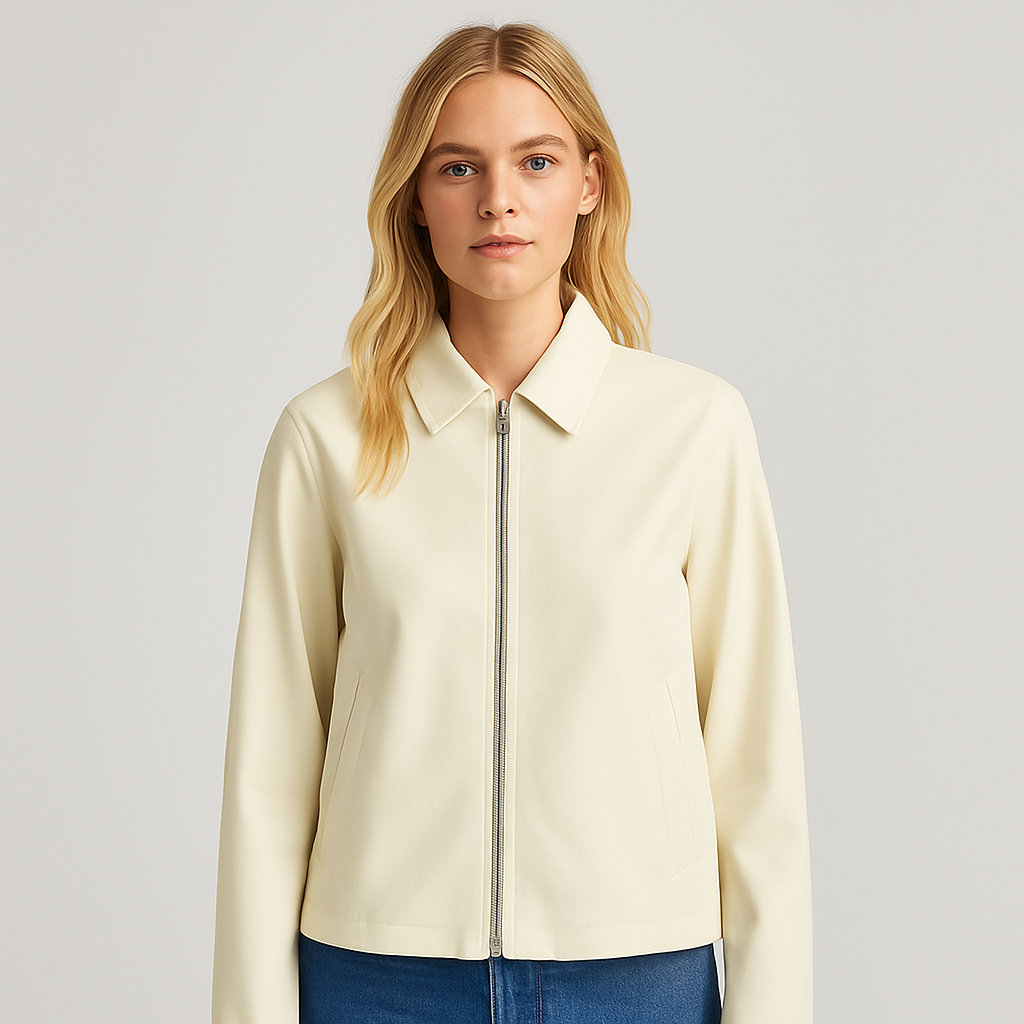 A minimalist jacket with a silver zipper front, classic shirt collar, and long sleeves.