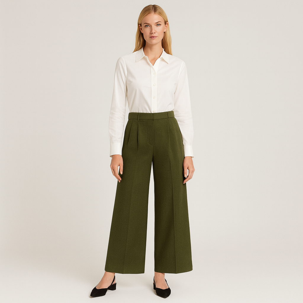 High-waisted wide-leg trousers with front pleats and side pockets, styled with a long-sleeve blouse for a polished look.
