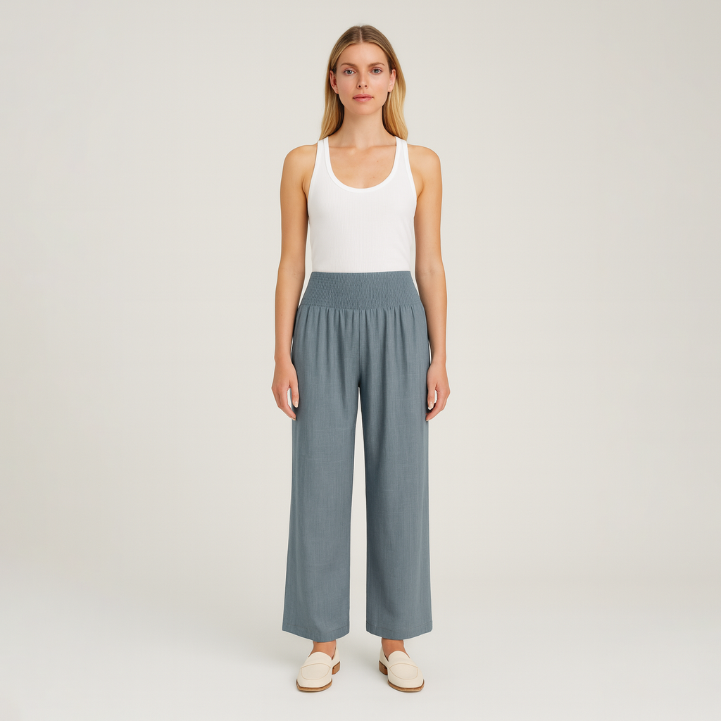 Wide-leg pants with smocked waistband and pleated detailing.