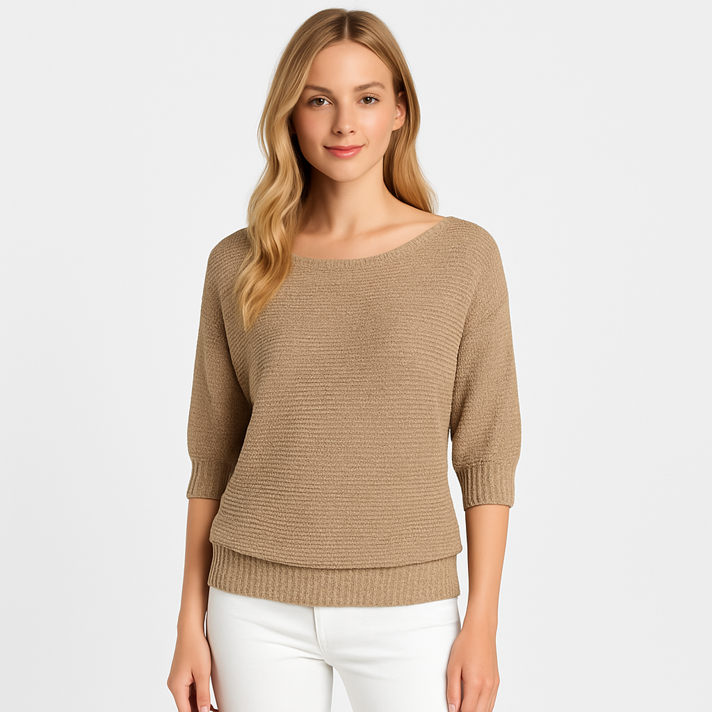 Knit top with relaxed fit, scoop neckline, and ribbed cuffs designed for versatile casual wear