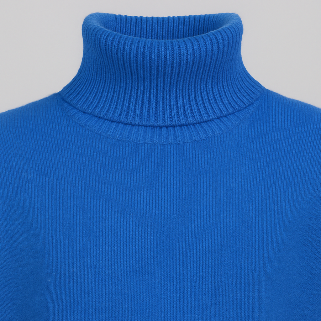 Oversized turtleneck sweater with dropped shoulders, long sleeves, and ribbed cuffs and hem, styled for casual cozy wear
