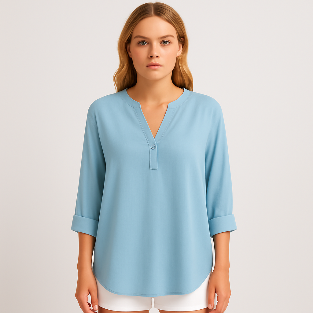 Light blue tunic blouse with notched V-neckline, flowy silhouette, and rolled sleeves.