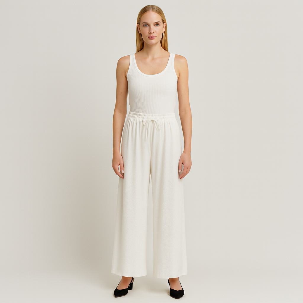 Wide-leg lounge pants with elastic drawstring waistband and flowy drape, styled for casual elegance