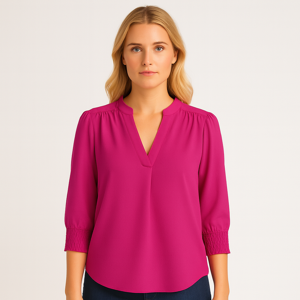 Blouse with V-neckline and smocked short sleeves.