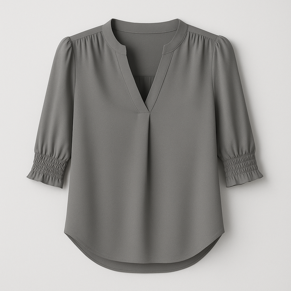 Blouse with V-neckline and smocked short sleeves.