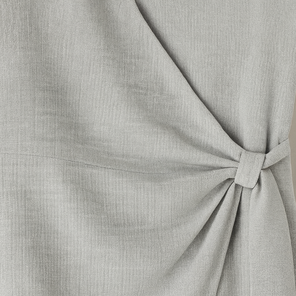 Sleeveless V-neck mini dress with vertical pleats and an asymmetrical hemline.