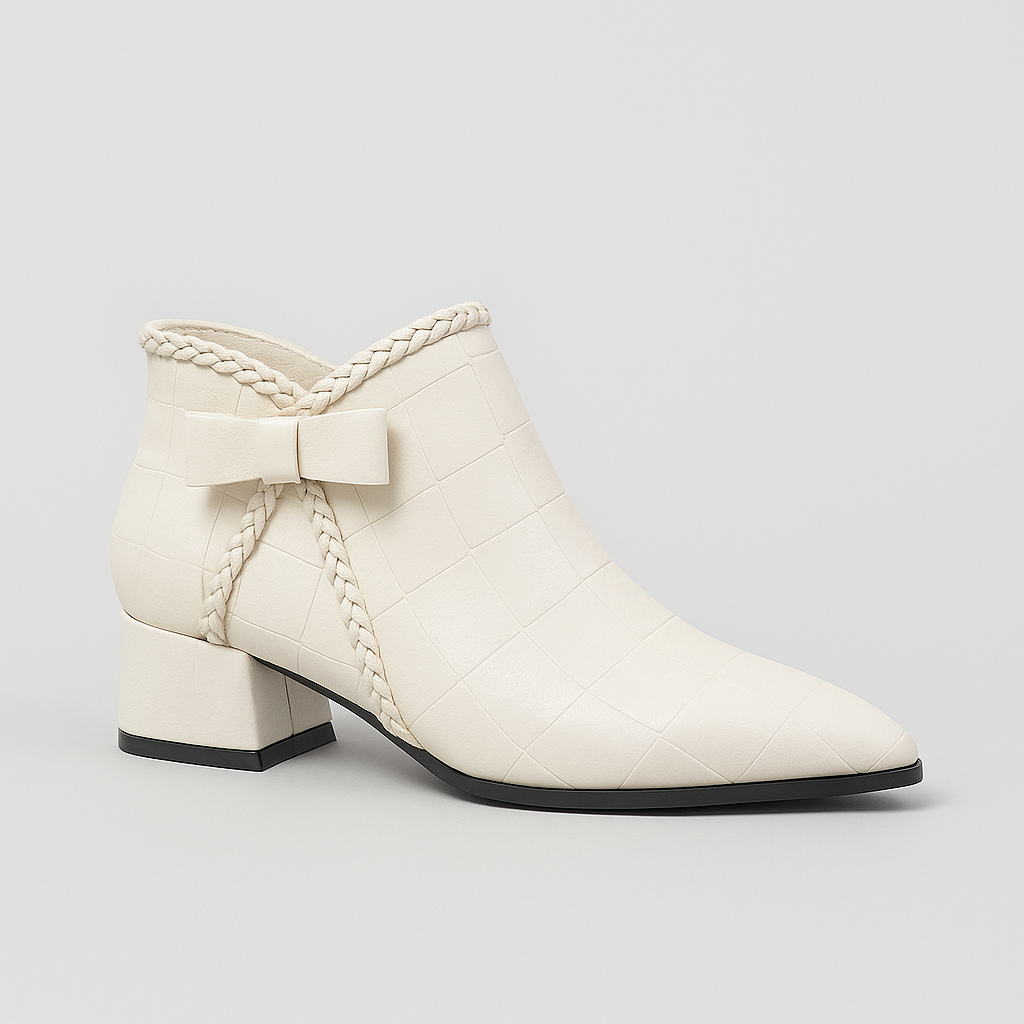 Ankle-high boots with side bow accent, low block heel, and zipper closure designed for versatile casual and dress wear